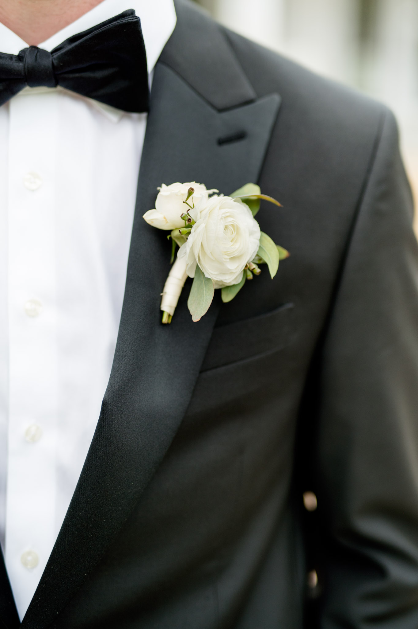 Closeup of groom's boutonniere.