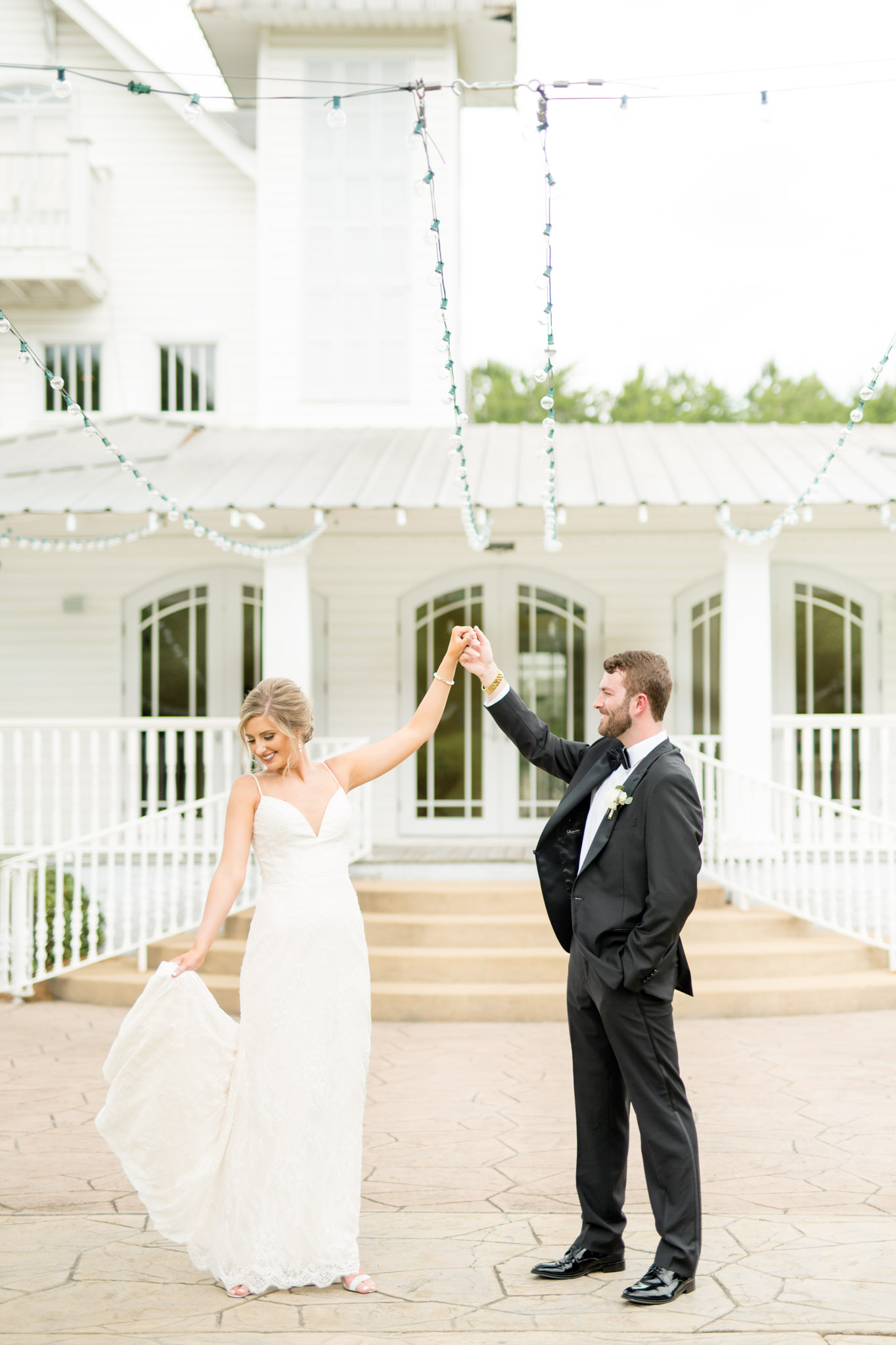 Groom twirls bride at The Sonnet House.