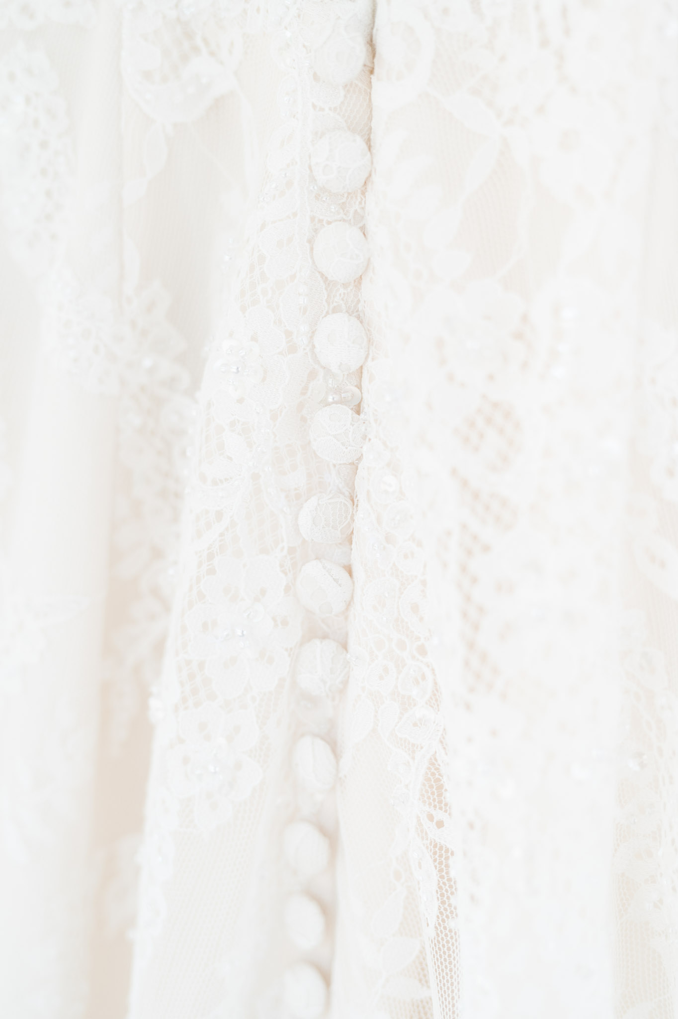 Buttons and lace on bridal gown.
