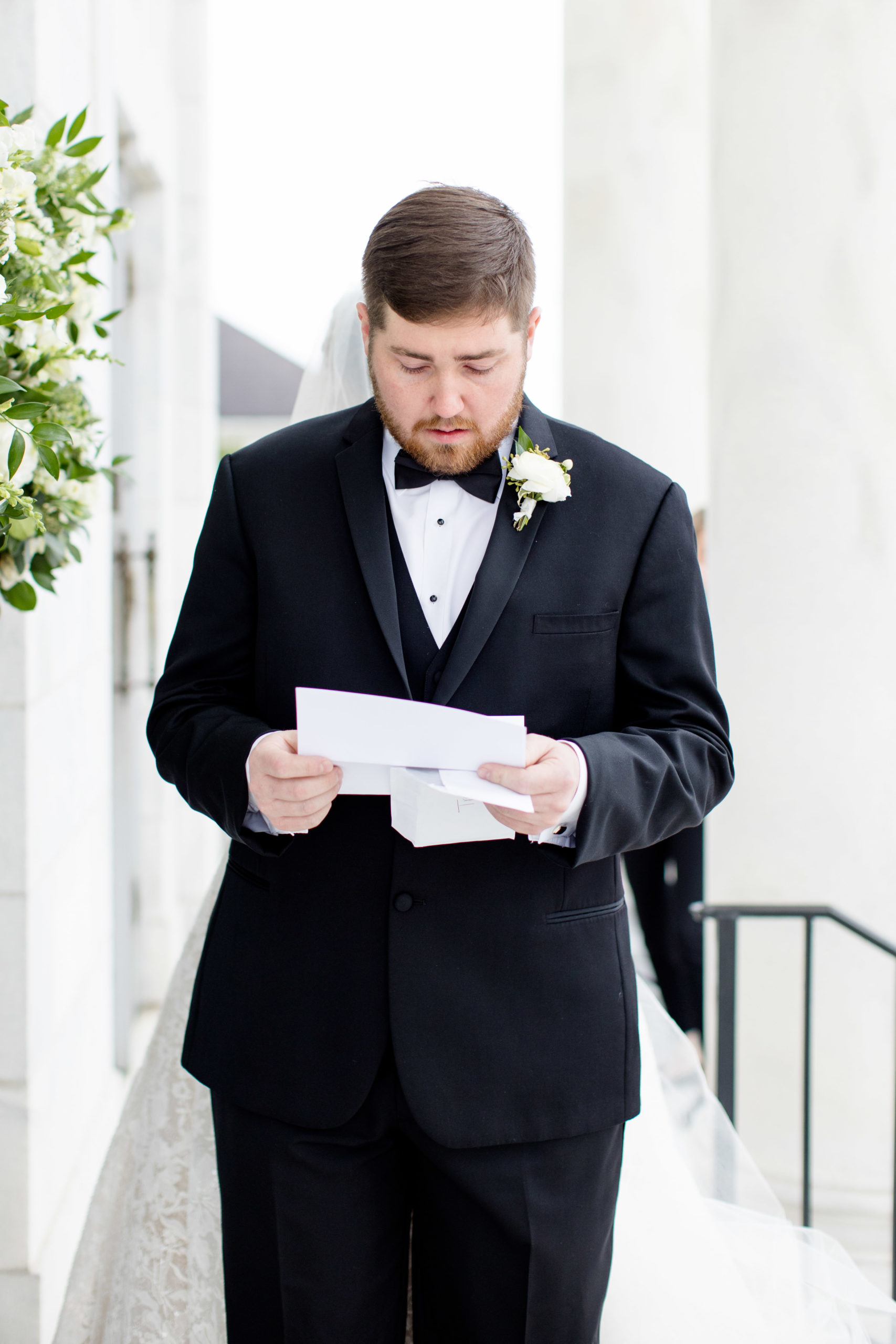 Groom reads letter from bride.