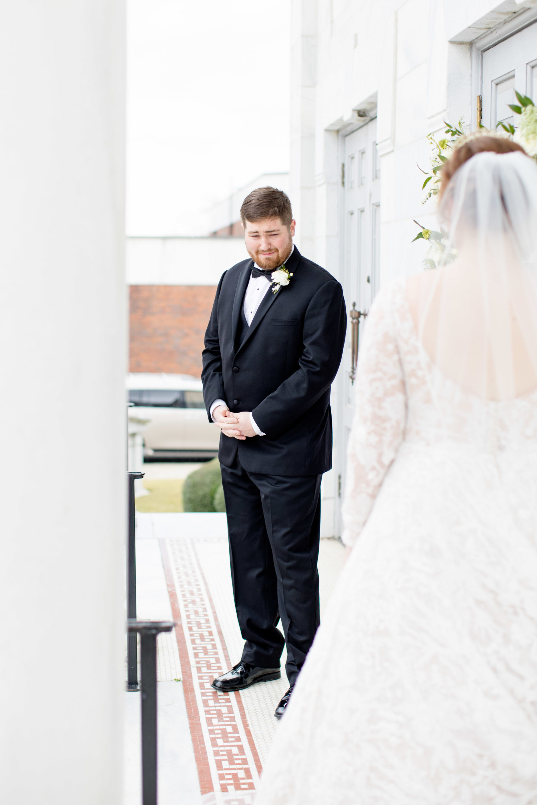 Groom starts to cry during first look.