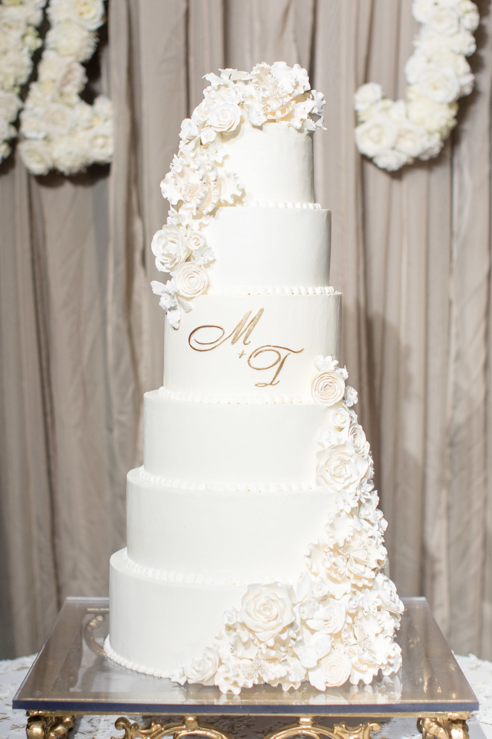 A white 6-teired wedding cake.