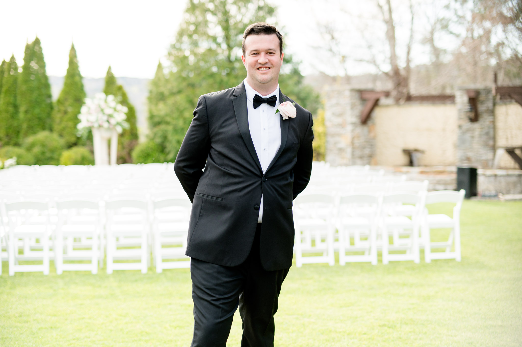 Groom smiles.