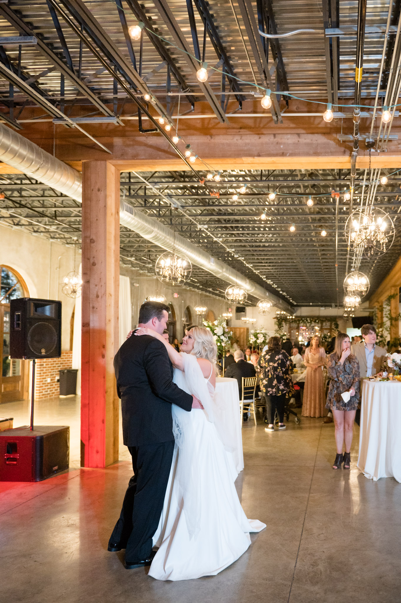 Bride and groom dance at wedding reception.