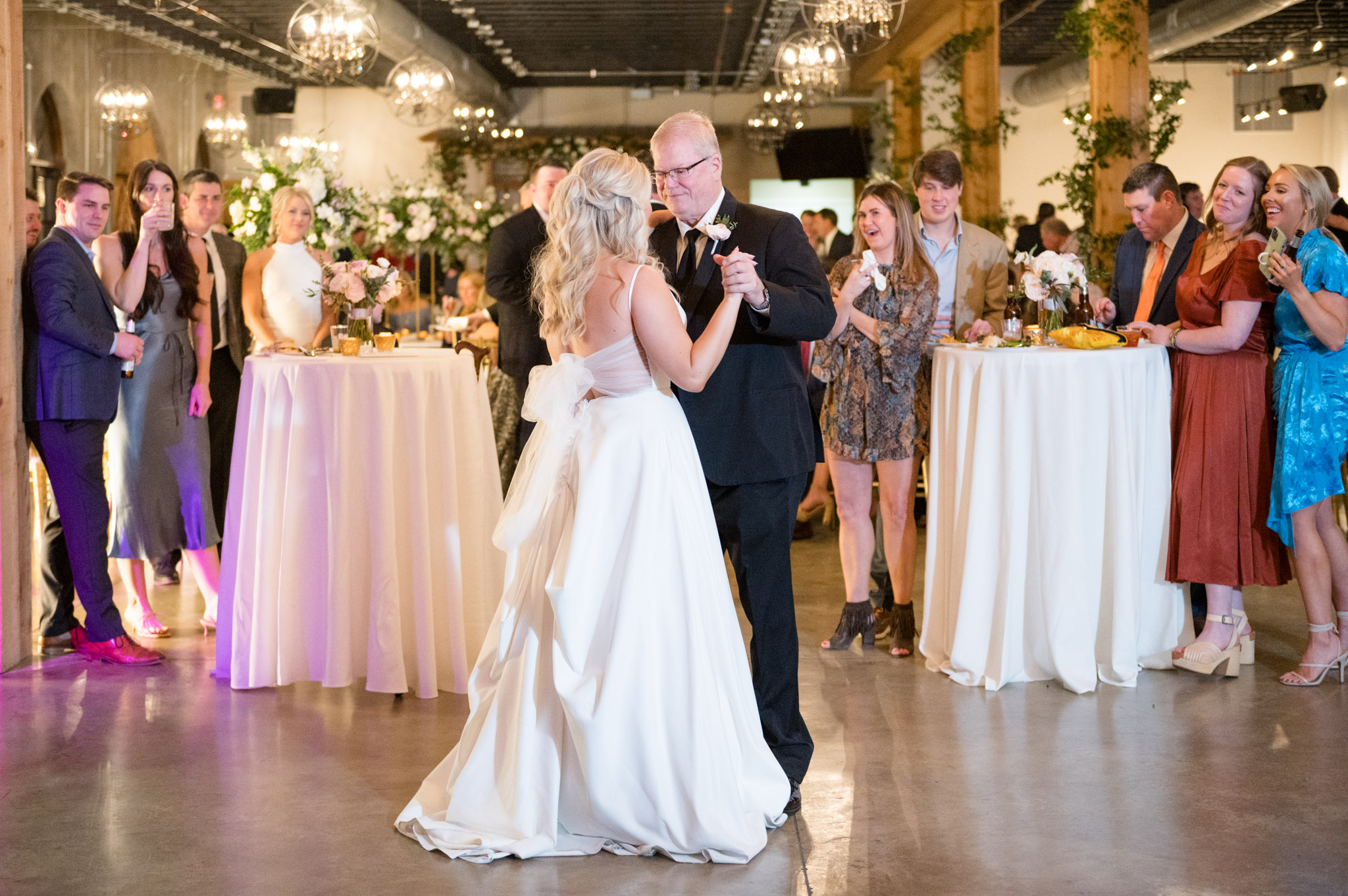 Bride dances with father.